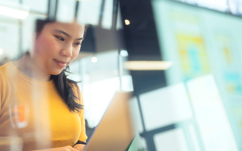 Professional- analyzing ERP and SAP Joule AI insights laptop